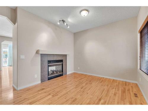 196 Panamount Circle Nw, Calgary, AB - Indoor Photo Showing Other Room With Fireplace