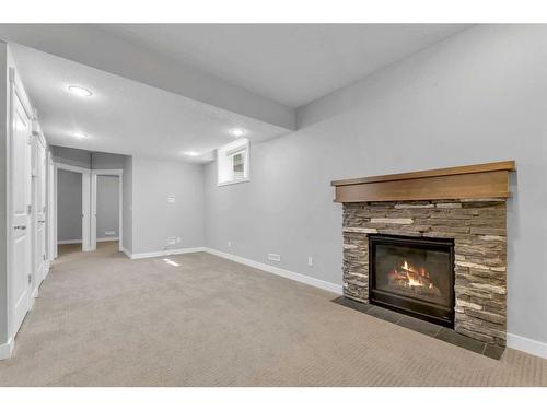 62 Nolanfield Manor Nw, Calgary, AB - Indoor Photo Showing Living Room With Fireplace