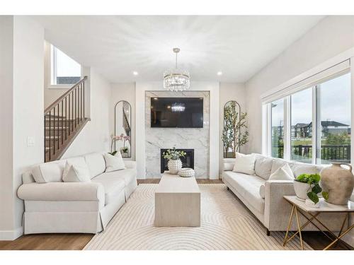 10 Highwood Drive, Okotoks, AB - Indoor Photo Showing Living Room With Fireplace