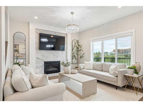 10 Highwood Drive, Okotoks, AB - Indoor Photo Showing Living Room With Fireplace