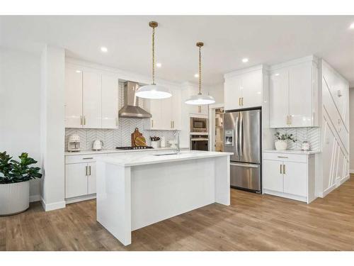 10 Highwood Drive, Okotoks, AB - Indoor Photo Showing Kitchen With Stainless Steel Kitchen With Upgraded Kitchen