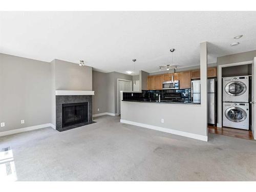 6-121 Village Heights Sw, Calgary, AB - Indoor With Fireplace