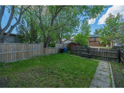 17 Bernard Drive Nw, Calgary, AB - Outdoor With Backyard