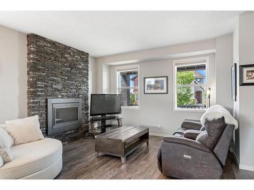 270 Marquis Court Se, Calgary, AB - Indoor Photo Showing Living Room With Fireplace