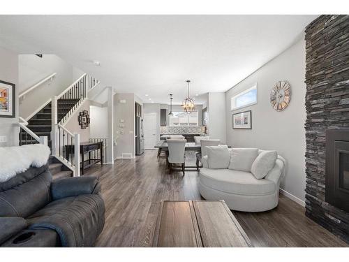 270 Marquis Court Se, Calgary, AB - Indoor Photo Showing Living Room With Fireplace