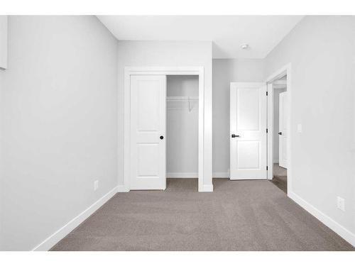 55 Amblehurst Link Nw, Calgary, AB - Indoor Photo Showing Other Room