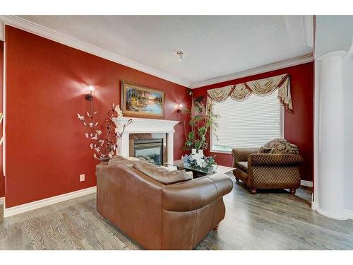 4670 Hamptons Way Nw, Calgary, AB - Indoor Photo Showing Living Room With Fireplace