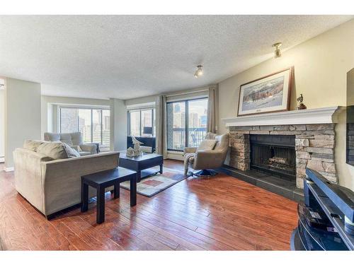 807-320 Meredith Road Ne, Calgary, AB - Indoor Photo Showing Living Room With Fireplace