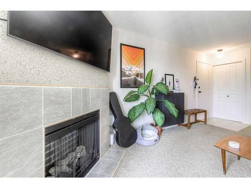 523-6400 Coach Hill Road Sw, Calgary, AB - Indoor With Fireplace