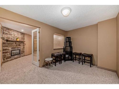 192 Brightondale Close Se, Calgary, AB - Indoor Photo Showing Other Room With Fireplace