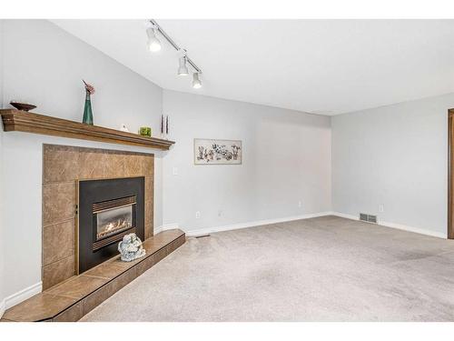 37 Shawinigan Drive Sw, Calgary, AB - Indoor With Fireplace