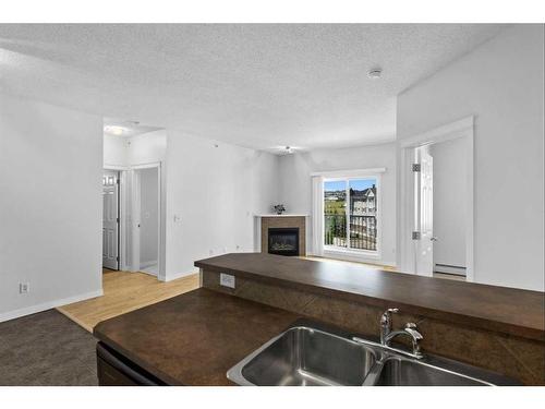 1411-5 Country Village Park Ne, Calgary, AB - Indoor With Fireplace