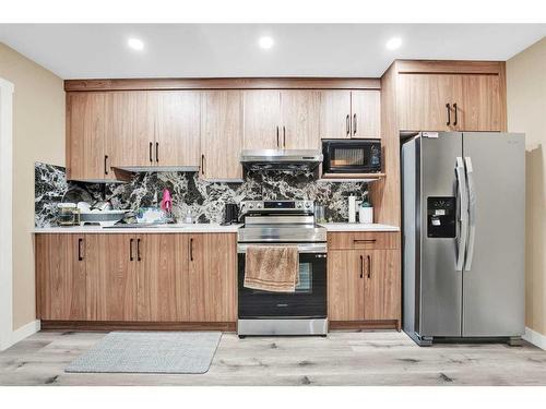 173 Savanna Passage Ne, Calgary, AB - Indoor Photo Showing Kitchen With Double Sink