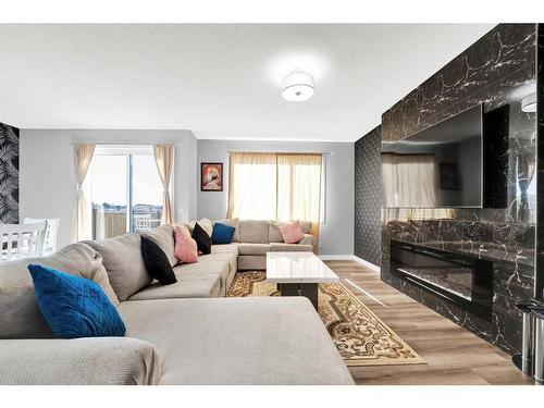 173 Savanna Passage Ne, Calgary, AB - Indoor Photo Showing Living Room With Fireplace