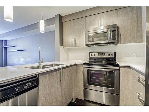 7306-302 Skyview Ranch Drive Ne, Calgary, AB - Indoor Photo Showing Kitchen With Stainless Steel Kitchen With Double Sink With Upgraded Kitchen