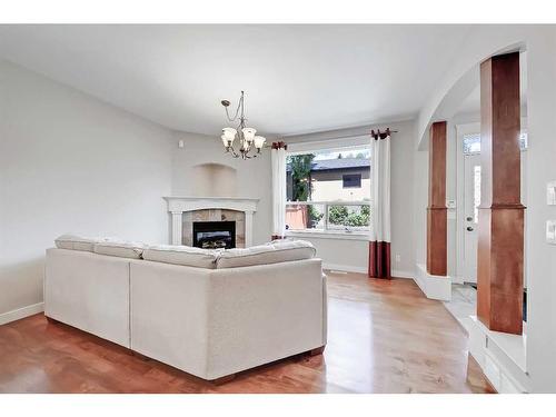 2410 7 Avenue Nw, Calgary, AB - Indoor Photo Showing Living Room With Fireplace