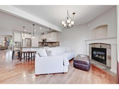 2410 7 Avenue Nw, Calgary, AB - Indoor Photo Showing Living Room With Fireplace