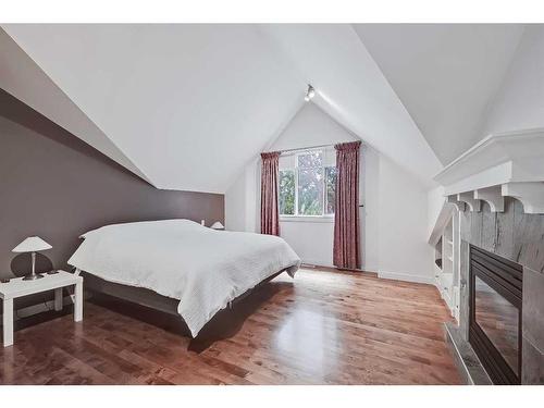 2410 7 Avenue Nw, Calgary, AB - Indoor Photo Showing Bedroom With Fireplace