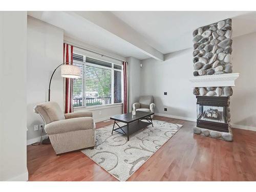 2410 7 Avenue Nw, Calgary, AB - Indoor Photo Showing Living Room With Fireplace