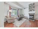 2410 7 Avenue Nw, Calgary, AB  - Indoor Photo Showing Living Room With Fireplace 