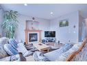 377 Taralake Landing Ne, Calgary, AB  - Indoor Photo Showing Living Room With Fireplace 