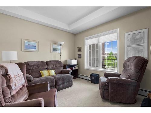 295-223 Tuscany Springs Boulevard Nw, Calgary, AB - Indoor Photo Showing Living Room