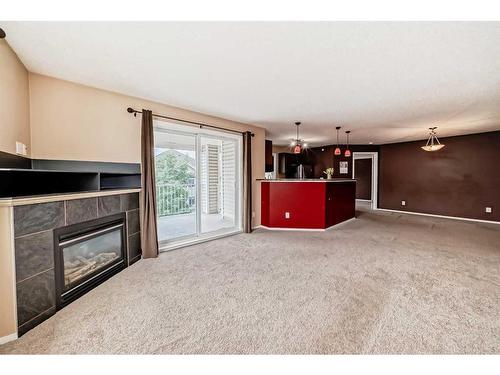 1419-16320 24 Street Sw, Calgary, AB - Indoor Photo Showing Other Room With Fireplace