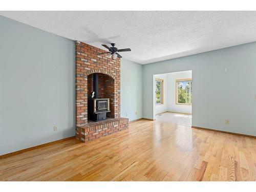 156 Riverbrook Way Se, Calgary, AB - Indoor Photo Showing Living Room With Fireplace