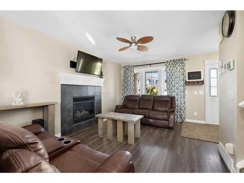 14 Ravenswynd Rise Se, Airdrie, AB - Indoor Photo Showing Living Room With Fireplace