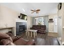 14 Ravenswynd Rise Se, Airdrie, AB  - Indoor Photo Showing Living Room With Fireplace 