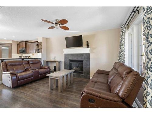 14 Ravenswynd Rise Se, Airdrie, AB - Indoor Photo Showing Living Room With Fireplace