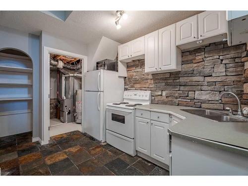 308 Taradale Drive Ne, Calgary, AB - Indoor Photo Showing Kitchen With Double Sink