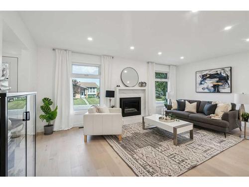 507 Cantrell Drive Sw, Calgary, AB - Indoor Photo Showing Living Room With Fireplace