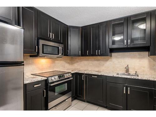 506-1011 12 Avenue Sw, Calgary, AB - Indoor Photo Showing Kitchen With Stainless Steel Kitchen With Upgraded Kitchen