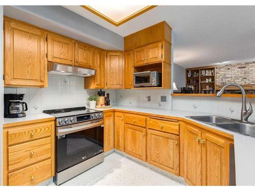 134 Scenic Park Crescent Nw, Calgary, AB - Indoor Photo Showing Kitchen With Double Sink