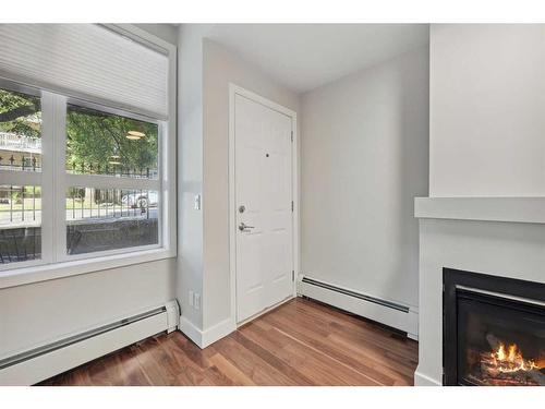 130-315 24 Avenue Sw, Calgary, AB - Indoor Photo Showing Other Room With Fireplace