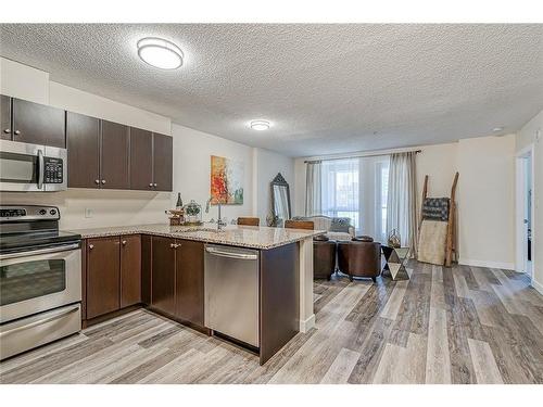 312-1053 10 Street Sw, Calgary, AB - Indoor Photo Showing Kitchen With Stainless Steel Kitchen