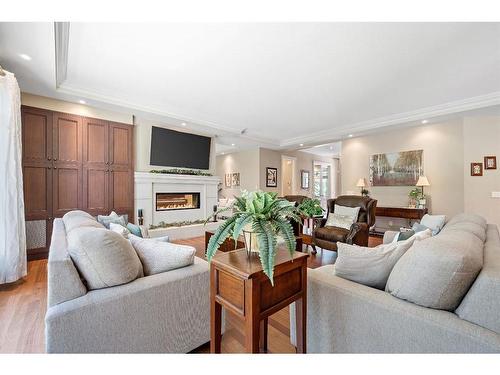 97 Posthill Drive Sw, Calgary, AB - Indoor Photo Showing Living Room With Fireplace