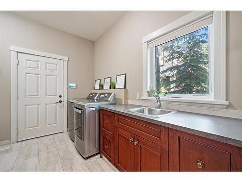 97 Posthill Drive Sw, Calgary, AB - Indoor Photo Showing Laundry Room