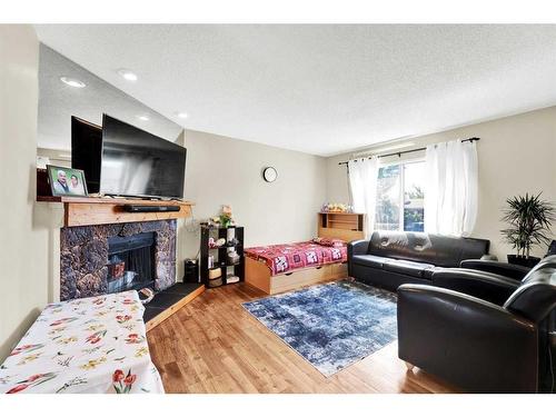 3408 56 Street Ne, Calgary, AB - Indoor Photo Showing Living Room With Fireplace