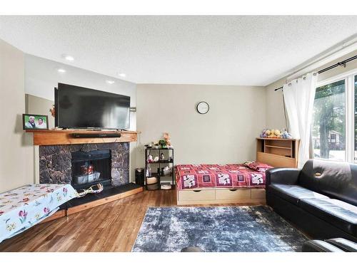 3408 56 Street Ne, Calgary, AB - Indoor Photo Showing Other Room With Fireplace