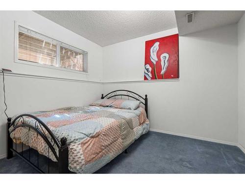 14764 Mt Mckenzie Drive Se, Calgary, AB - Indoor Photo Showing Bedroom