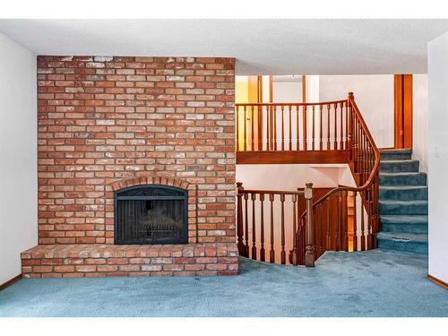 1220 Varsity Estates Road Nw, Calgary, AB - Indoor Photo Showing Living Room With Fireplace