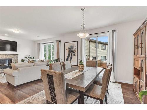 16 Masters Way Se, Calgary, AB - Indoor With Fireplace