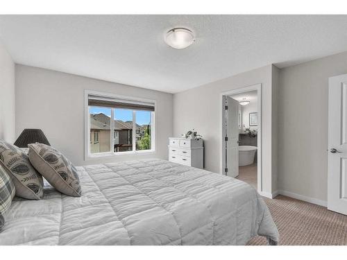 16 Masters Way Se, Calgary, AB - Indoor Photo Showing Bedroom