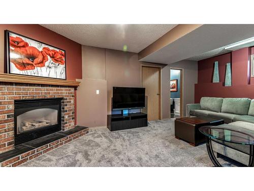 234 Covington Close Ne, Calgary, AB - Indoor Photo Showing Living Room With Fireplace