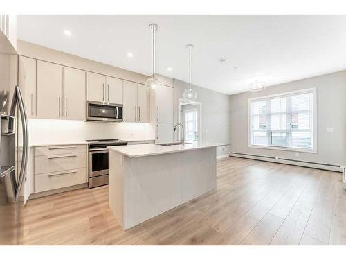 223-383 Smith Street Nw, Calgary, AB - Indoor Photo Showing Kitchen With Stainless Steel Kitchen With Upgraded Kitchen