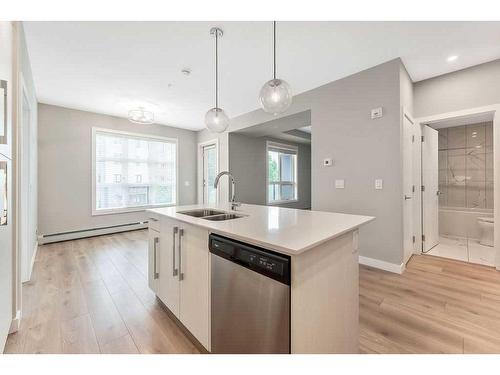 223-383 Smith Street Nw, Calgary, AB - Indoor Photo Showing Kitchen With Double Sink With Upgraded Kitchen