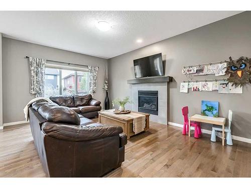 22 Mount Rae Place, Okotoks, AB - Indoor Photo Showing Living Room With Fireplace
