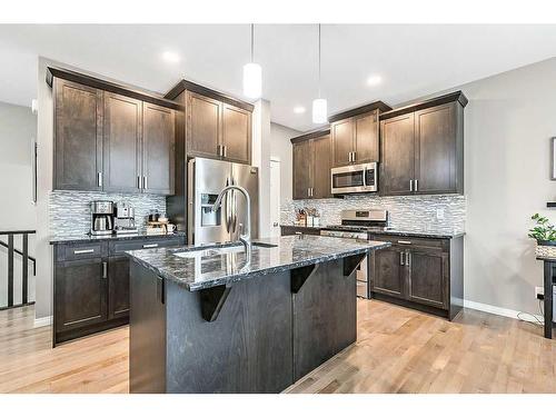 22 Mount Rae Place, Okotoks, AB - Indoor Photo Showing Kitchen With Upgraded Kitchen